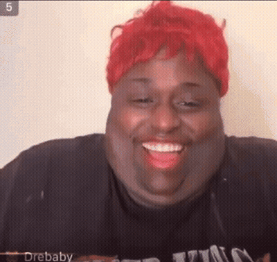 Woman With Red Hair And Black Shirt Smiling GIF