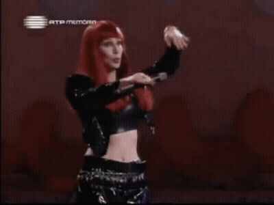 Woman With Red Hair And Crop Top In Front Of Rtp Memoria Sign GIF