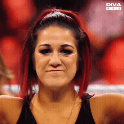 Woman With Red Hair And Diva Bible Logo On Face GIF
