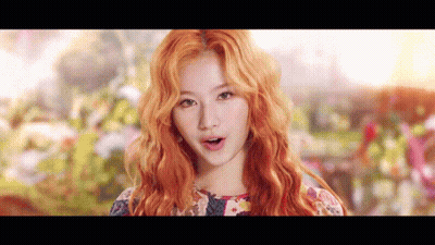Woman With Red Hair And Floral Dress GIF