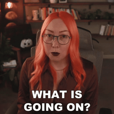 Woman With Red Hair And Glasses Asking What Is Going On GIF
