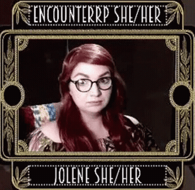 Woman With Red Hair And Glasses In Frame GIF
