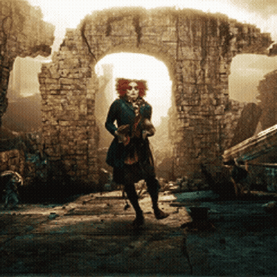Woman With Red Hair And Glasses In Front Of Brick Archway GIF