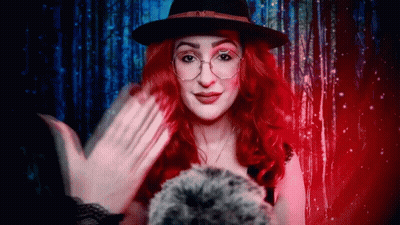 Woman With Red Hair And Glasses Wearing Hat GIF