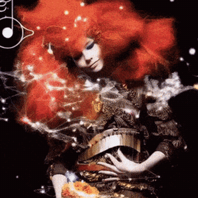 Woman With Red Hair And Gold Belt Surrounded By Smoke GIF