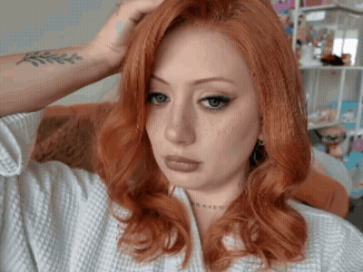 Woman With Red Hair And Heaven Tattoo GIF