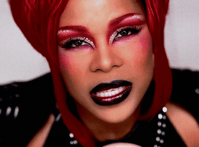 Woman With Red Hair And Makeup Close Up GIF