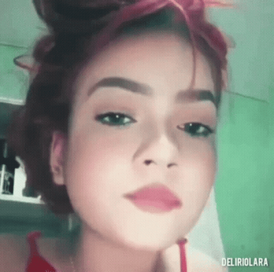 Woman With Red Hair And Red Shirt GIF