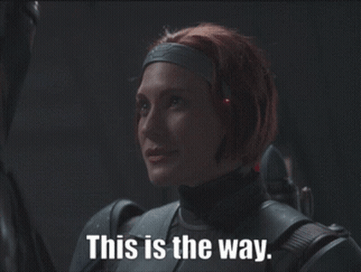 Woman With Red Hair Holding Gun GIF