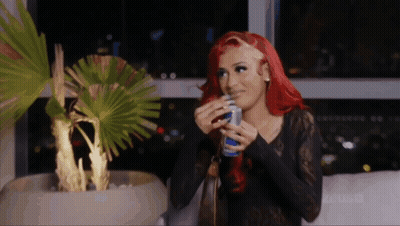Woman With Red Hair Holding Pepsi Can GIF