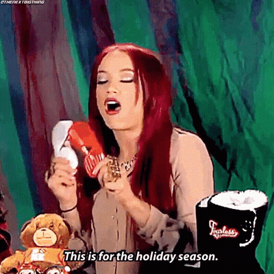Woman With Red Hair Holding Stuffed Animal GIF