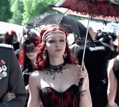 Woman With Red Hair Holding Umbrella GIF