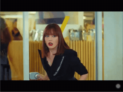 Woman With Red Hair In Black Shirt Saying I Love You GIF