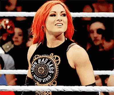 Woman With Red Hair In Black Tank Top Saying Bad Ass GIF