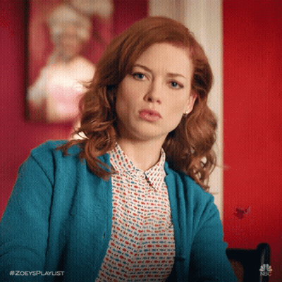 Woman With Red Hair In Blue Cardigan GIF