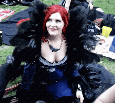 Woman With Red Hair In Blue Dress And Black Fur GIF
