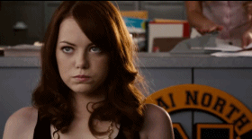 Woman With Red Hair In Front Of AI North Sign GIF