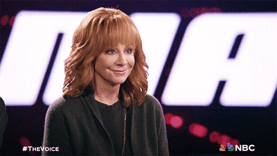 Woman With Red Hair In Front Of NBC Logo GIF