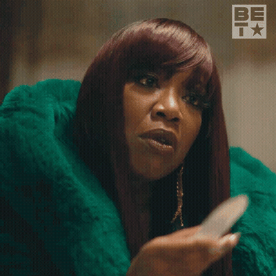 Woman With Red Hair In Green Fur Coat Says Im Serious GIF