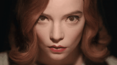 Woman With Red Hair In Green Knitted Hat Coughing GIF
