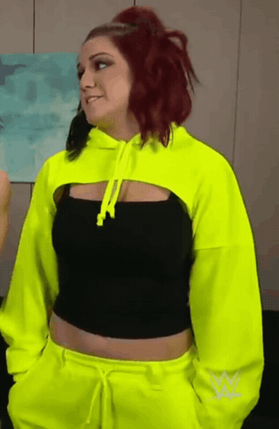 Woman With Red Hair In Neon Yellow Hoodie GIF