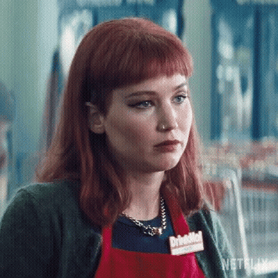 Woman With Red Hair In Red Apron And Necklace GIF