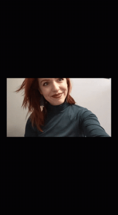 Woman With Red Hair In Turtleneck GIF