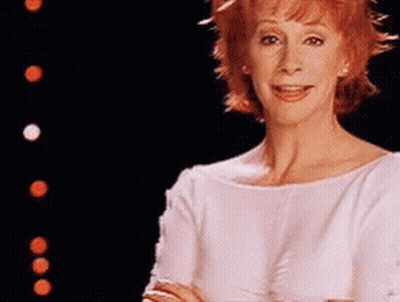 Woman With Red Hair In White Top GIF