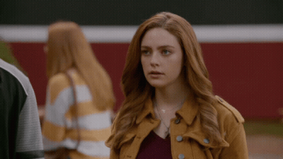 Woman With Red Hair In Yellow Jacket GIF