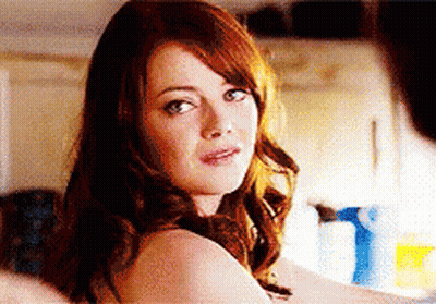 Woman With Red Hair Looking At Camera GIF