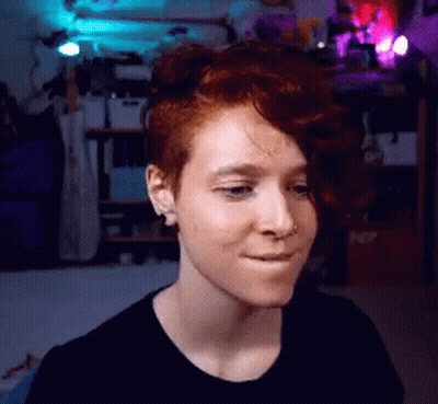 Woman With Red Hair Making Face GIF