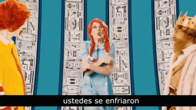Woman With Red Hair Next To McDonald's Character And Man In Crown GIF