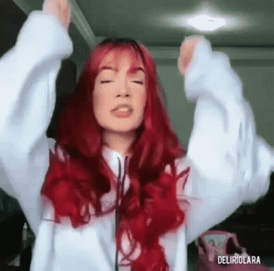 Woman With Red Hair Raising Arms GIF