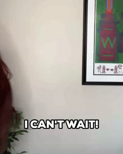 Woman With Red Hair Saying I Can T Wait In Front Of Framed Picture GIF