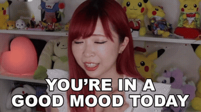 Woman With Red Hair Saying You're In A Good Mood Today GIF