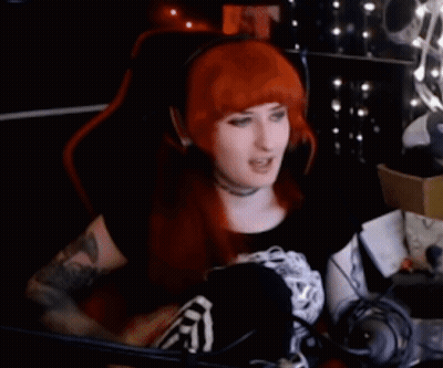 Woman With Red Hair Sitting In Gaming Chair GIF