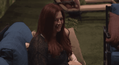 Woman With Red Hair Sitting On Blue Chair GIF
