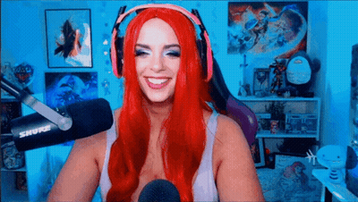 Woman With Red Hair Smiling At Microphone GIF