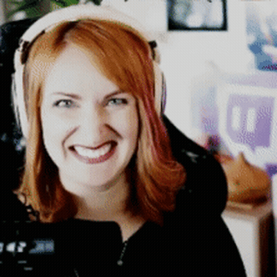 Woman With Red Hair Smiling In Headphones GIF