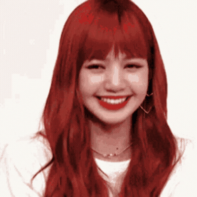 Woman With Red Hair Smiling In White Shirt And Earrings GIF