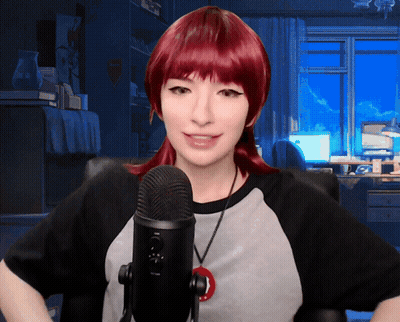 Woman With Red Hair Speaking Into Black Microphone GIF