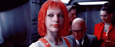 Woman With Red Hair Standing With Group GIF