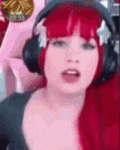 Woman With Red Hair Wearing Headphones GIF