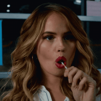 Woman With Red Lips Eating Lollipop GIF