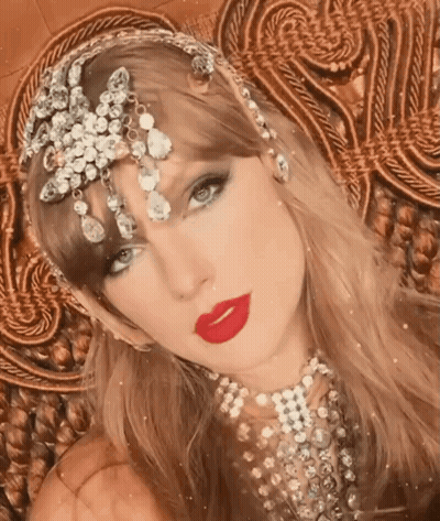 Woman With Red Lipstick And Rhinestone Headpiece GIF