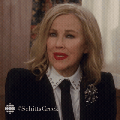 Woman With Red Lipstick And Schitt's Creek Logo GIF