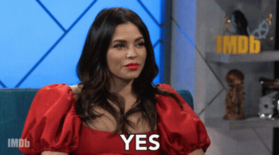 Woman With Red Lipstick And White Flower In Hair GIF