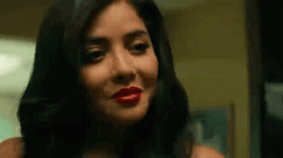 Woman With Red Lipstick Looking At Camera GIF