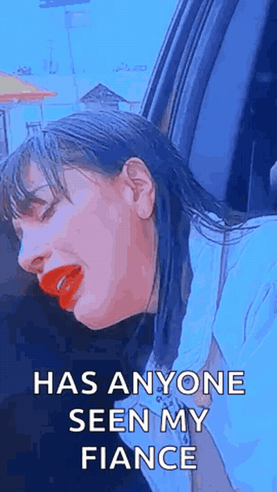 Woman With Red Lipstick Sitting In Car Eyes Closed GIF