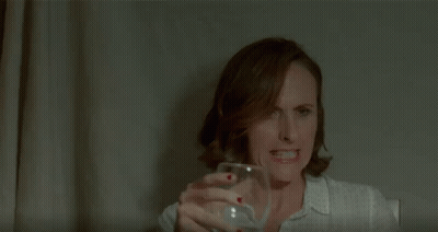 Woman With Red Nail Polish Covering Nose GIF